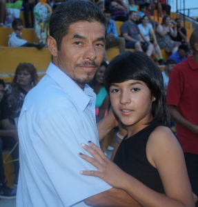 Miriam and her father dancing at the school graduation