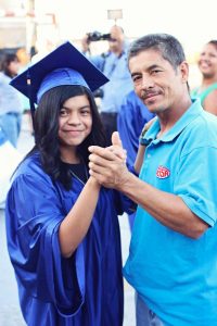 Blanca dancing with her dad at her graduation